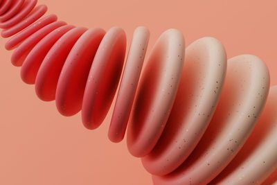 a close up of a pink object on a pink background