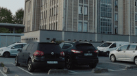 a parking lot with several cars parked in it