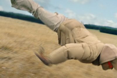 a man flying through the air while riding a skateboard