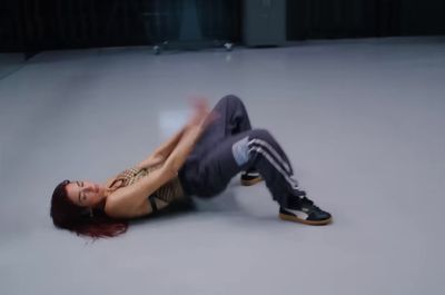 a woman laying on the ground on her stomach