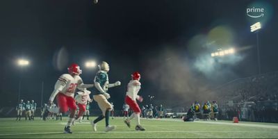 a group of people on a field playing football