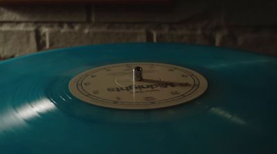 a close up of a blue record player