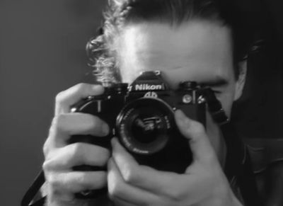 a man taking a picture of himself with a camera