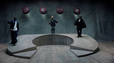 a group of men standing on top of a stage