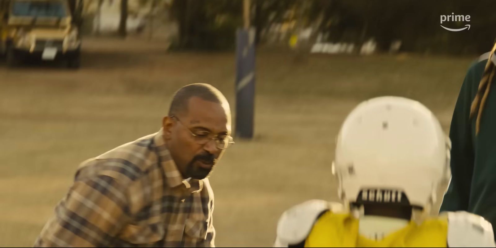 a man standing next to a yellow fire hydrant