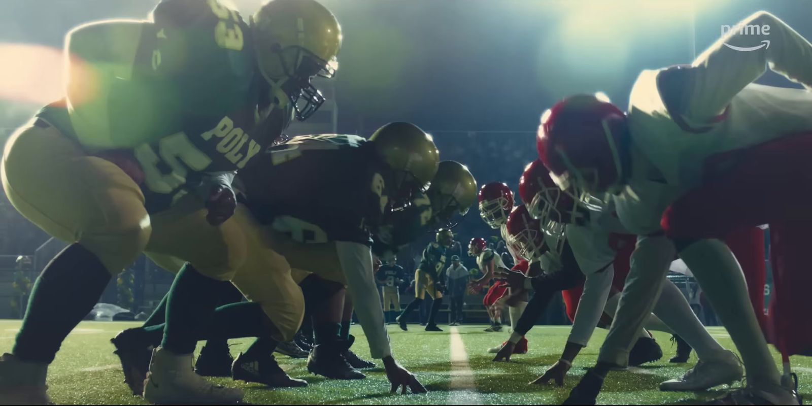 a group of football players standing on top of a field