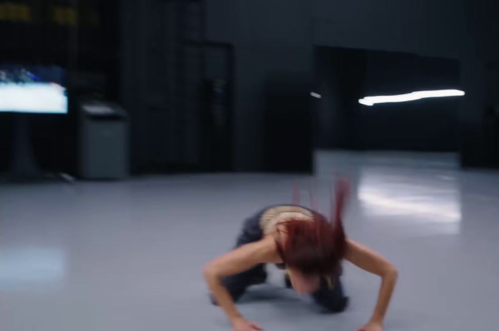 a blurry photo of a woman on the ground