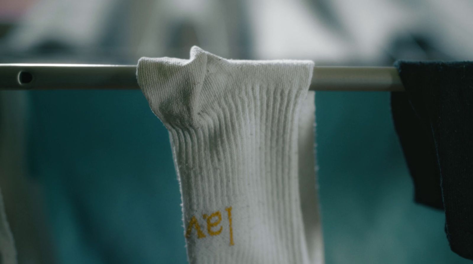 a pair of socks hanging on a clothes line