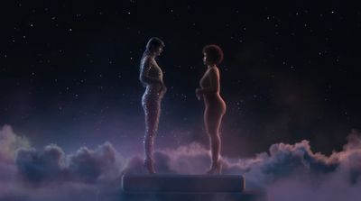 a couple of women standing on top of a cloud filled sky