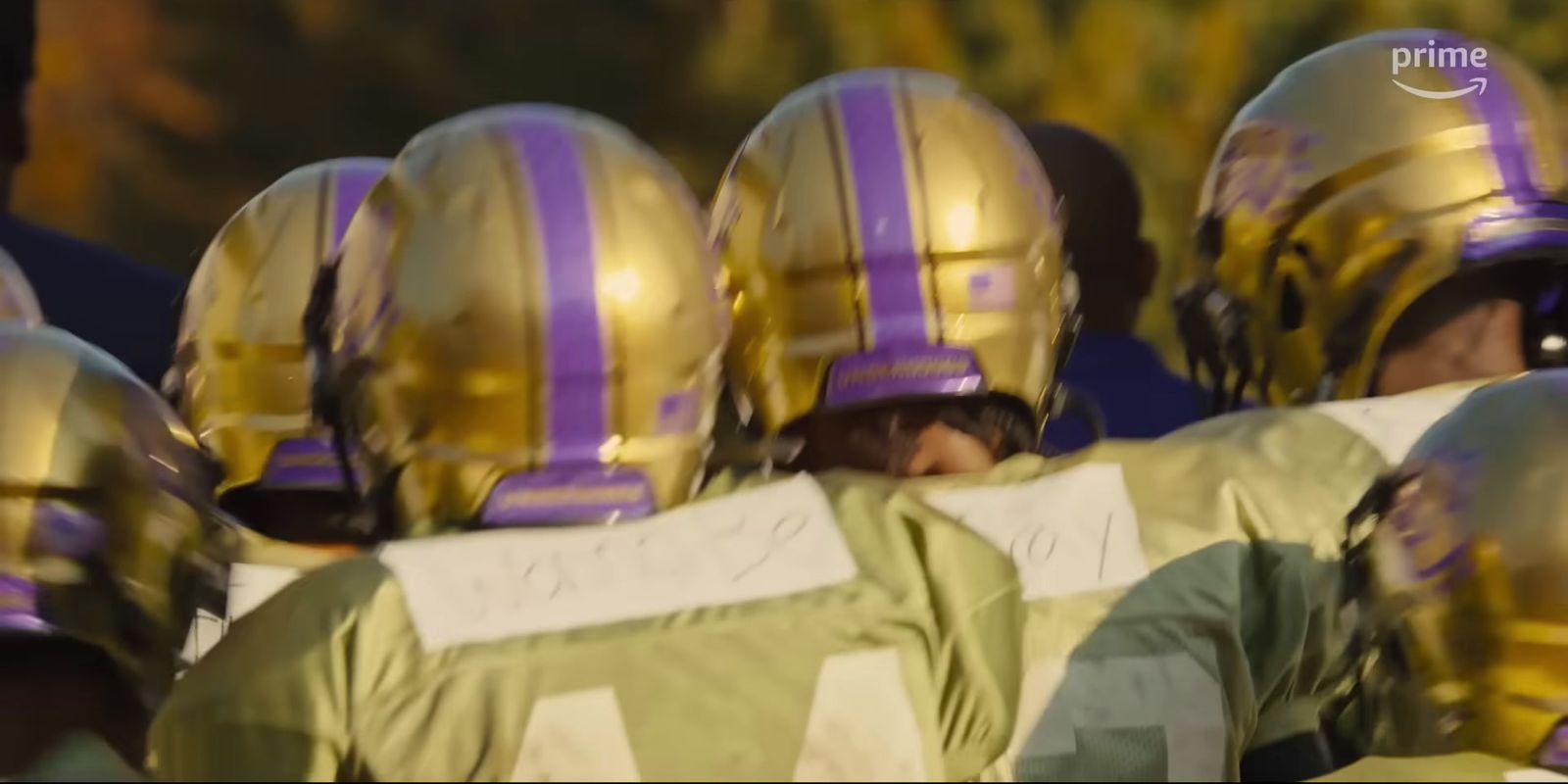 a group of football players standing next to each other