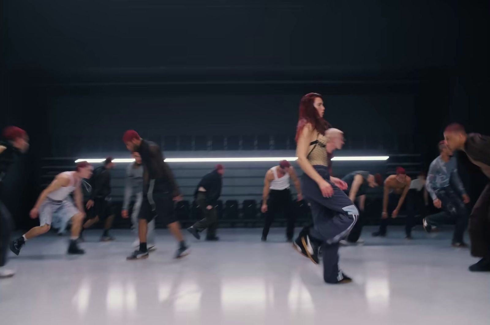 a group of people dancing in a dance studio