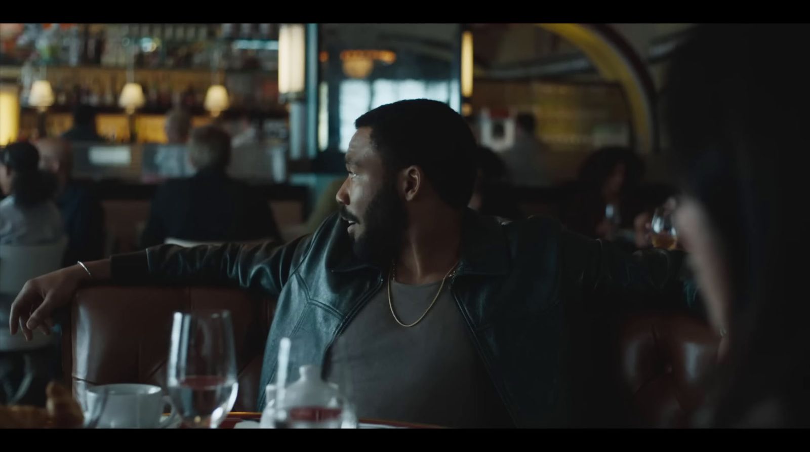 a man sitting at a table in a restaurant