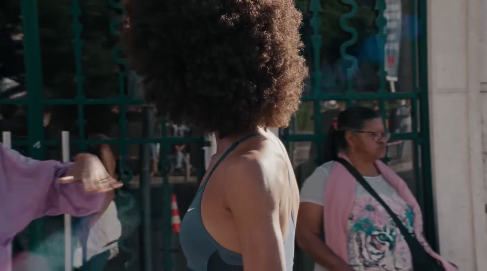 a group of women standing outside of a building