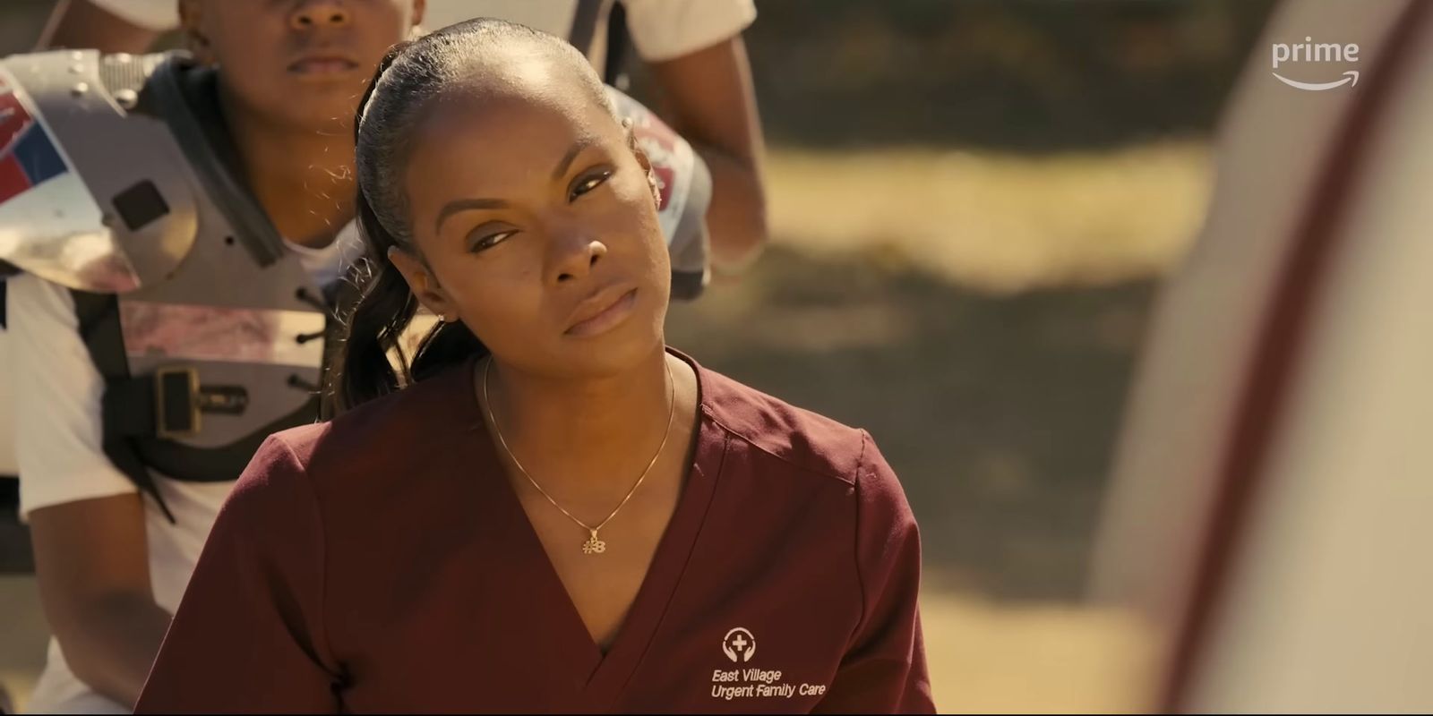 a woman in a maroon shirt and a woman in a white shirt