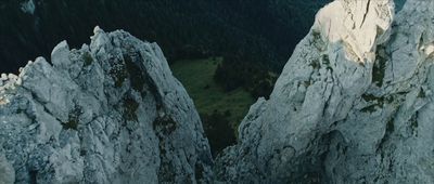 a view of some very tall rocks in the mountains