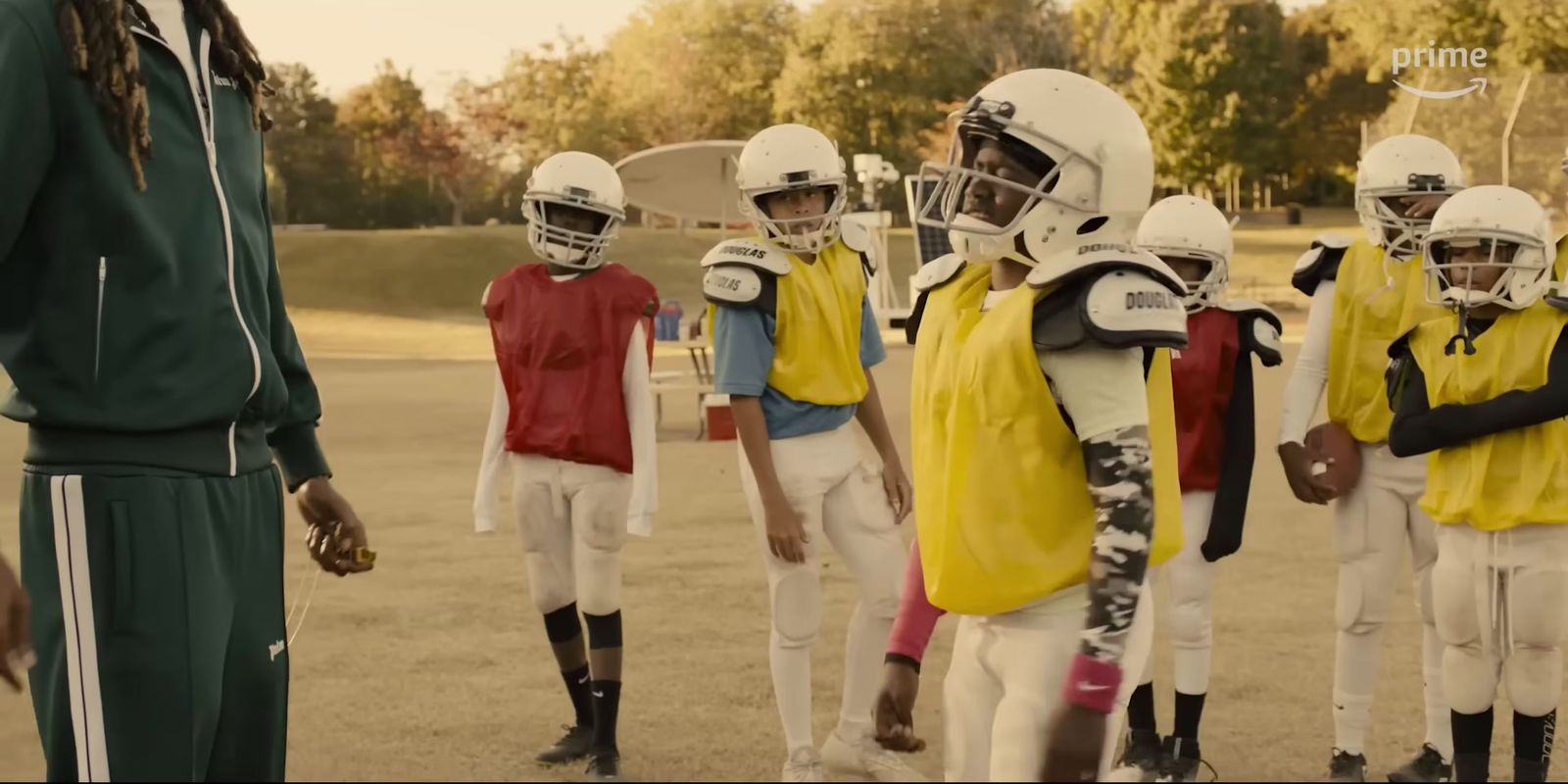 a group of young football players standing next to each other