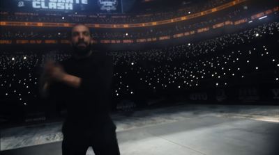 a man standing in front of an empty arena