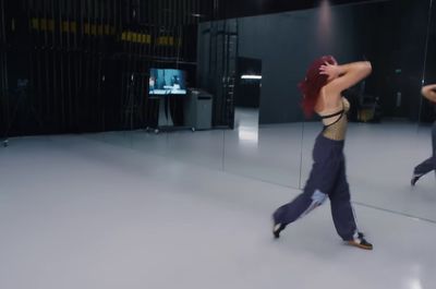 a woman is dancing in a dance studio