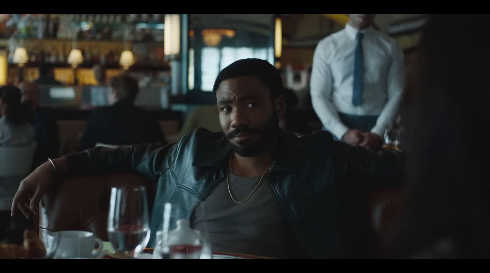 a man sitting at a table in a restaurant