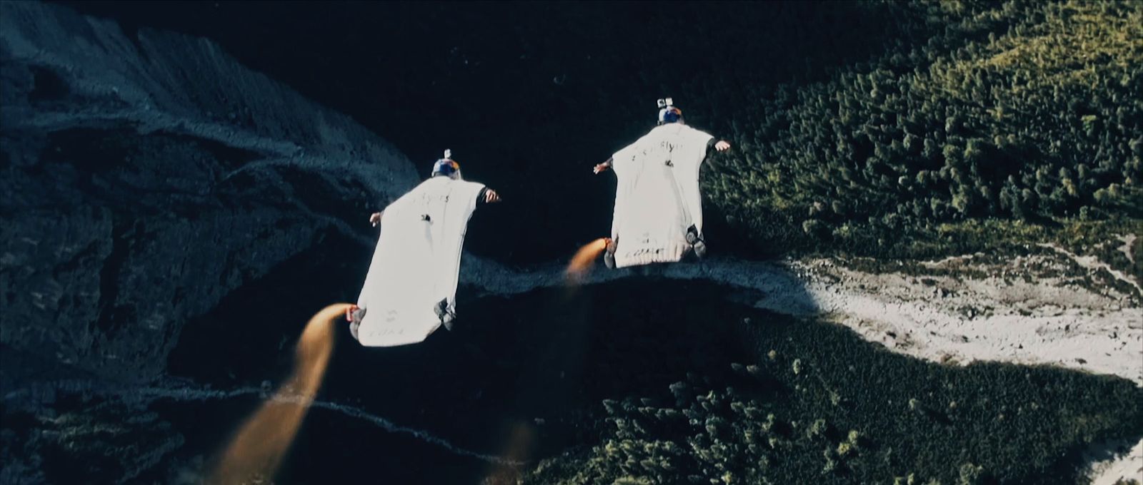 a couple of people on surfboards in the water