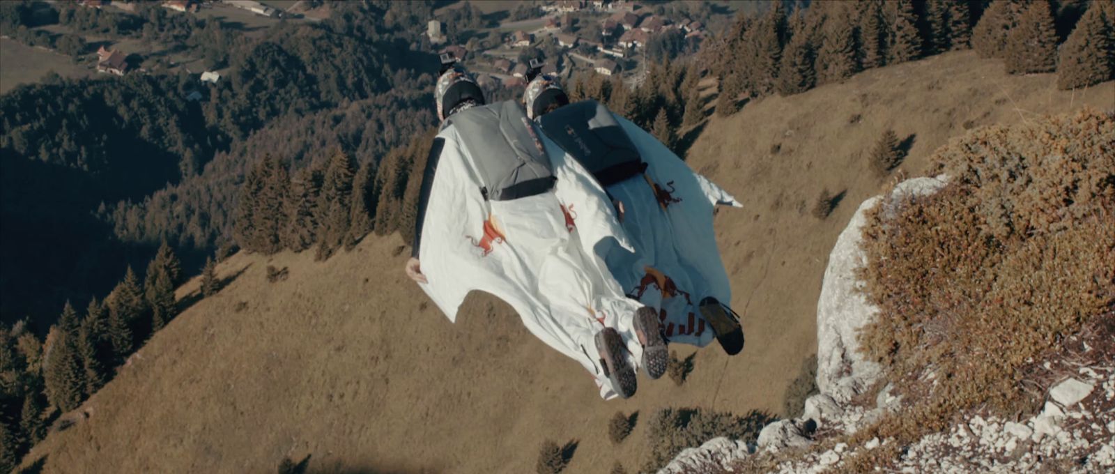 a fighter jet sitting on top of a mountain