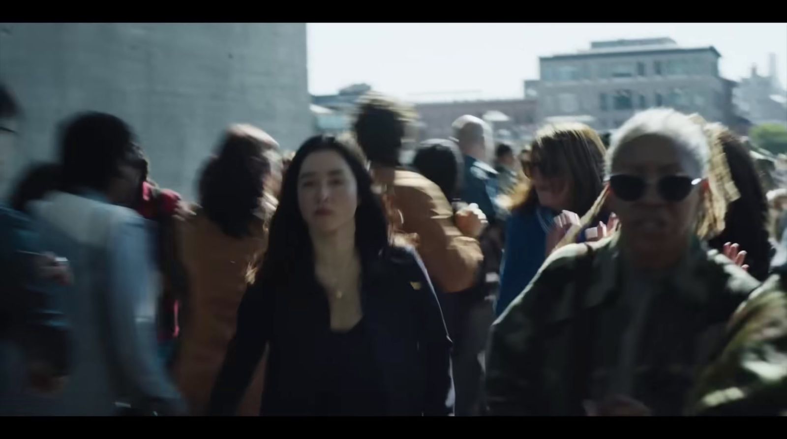 a group of people walking down a street