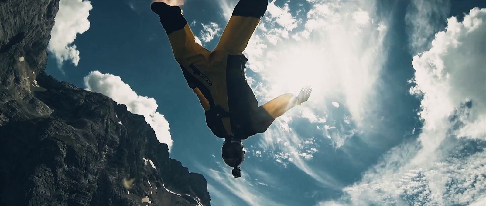 a man flying through the air while riding a skateboard