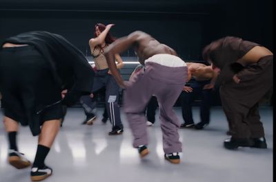 a group of people dancing in a room