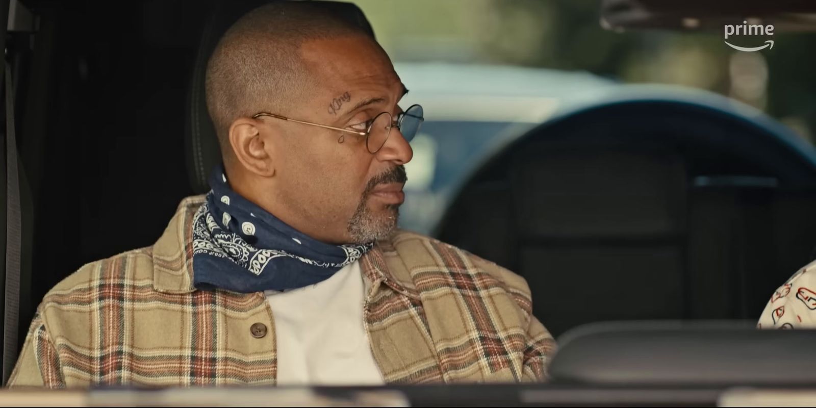 a man sitting in the back of a car