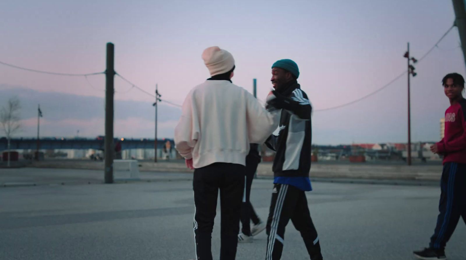 a group of young men walking across a street