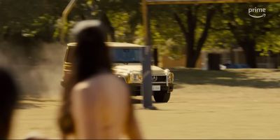 a woman standing in front of a truck