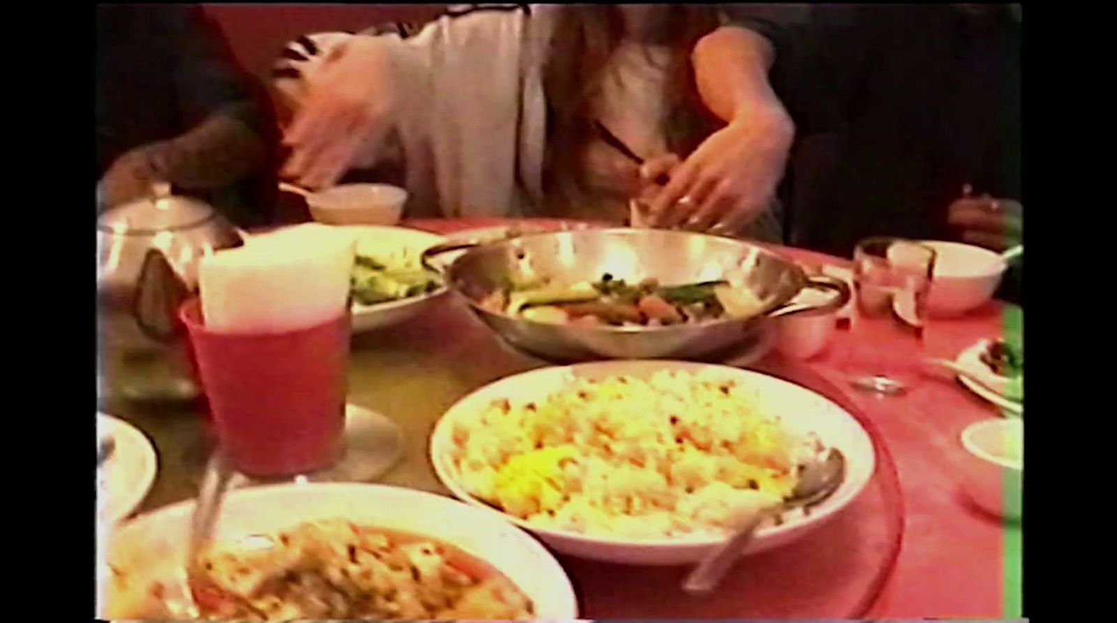 a table topped with lots of plates of food