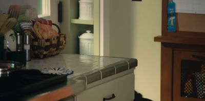 a kitchen counter with a basket on top of it