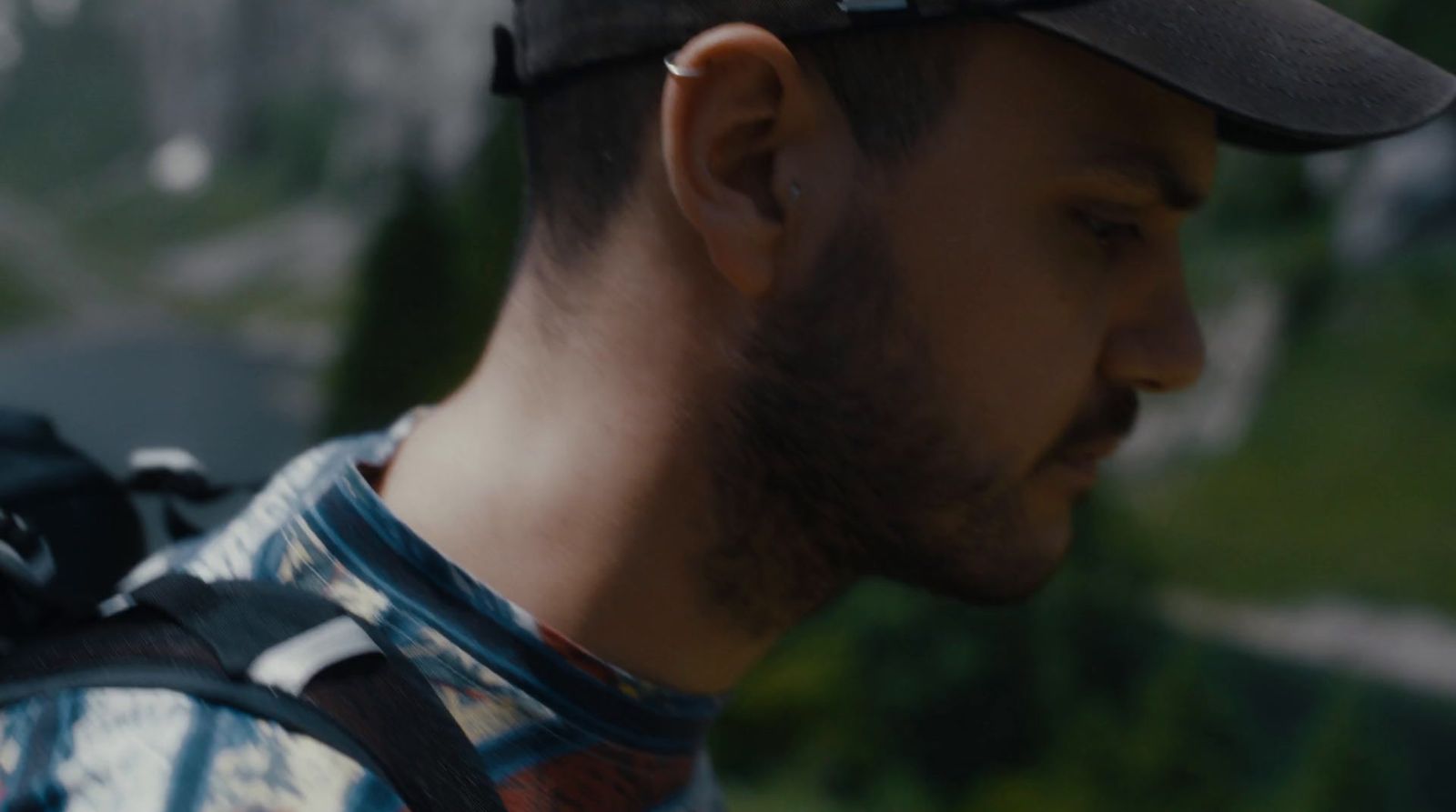 a man with a beard wearing a backpack