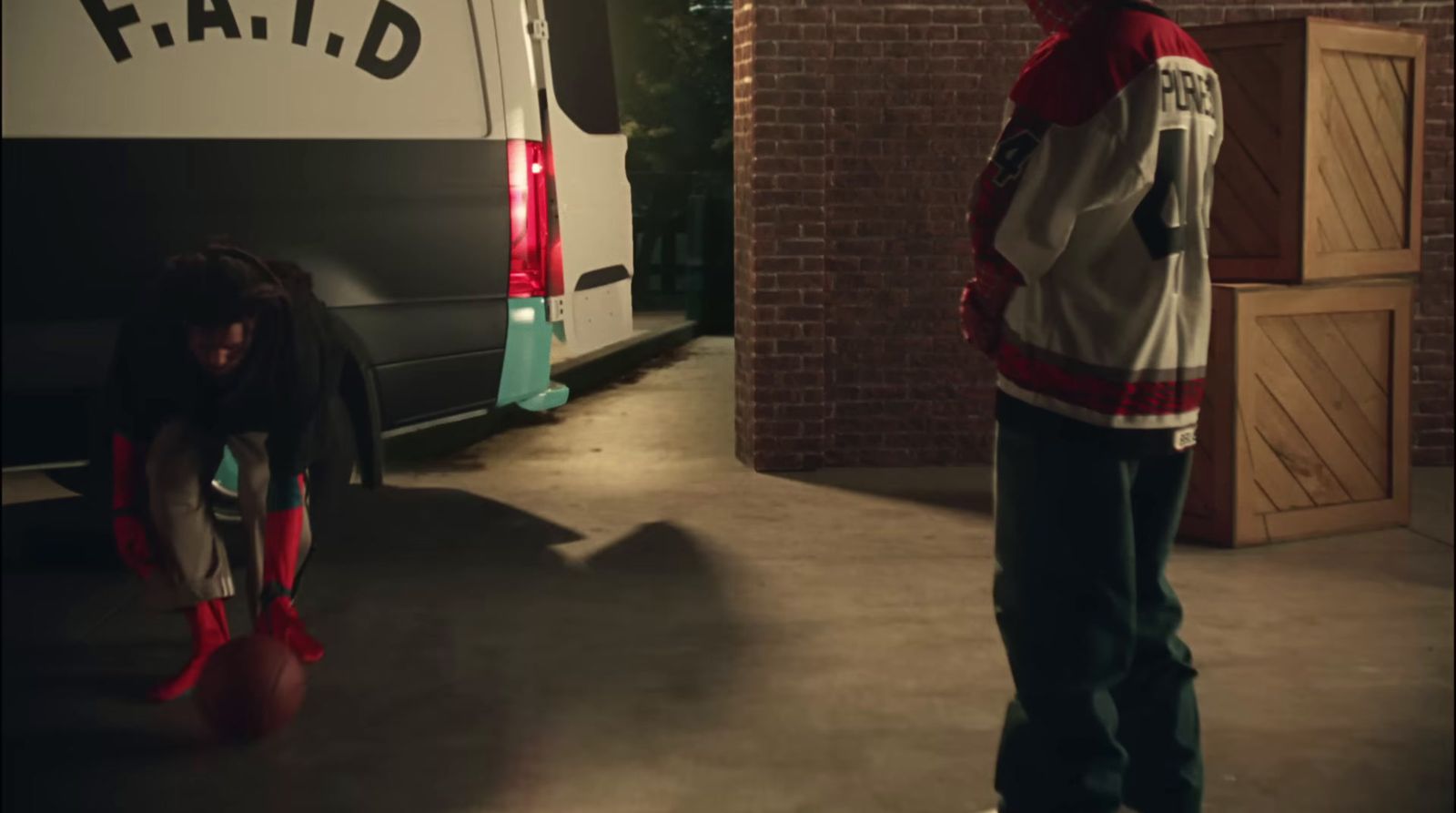 a man standing next to a woman in front of a van