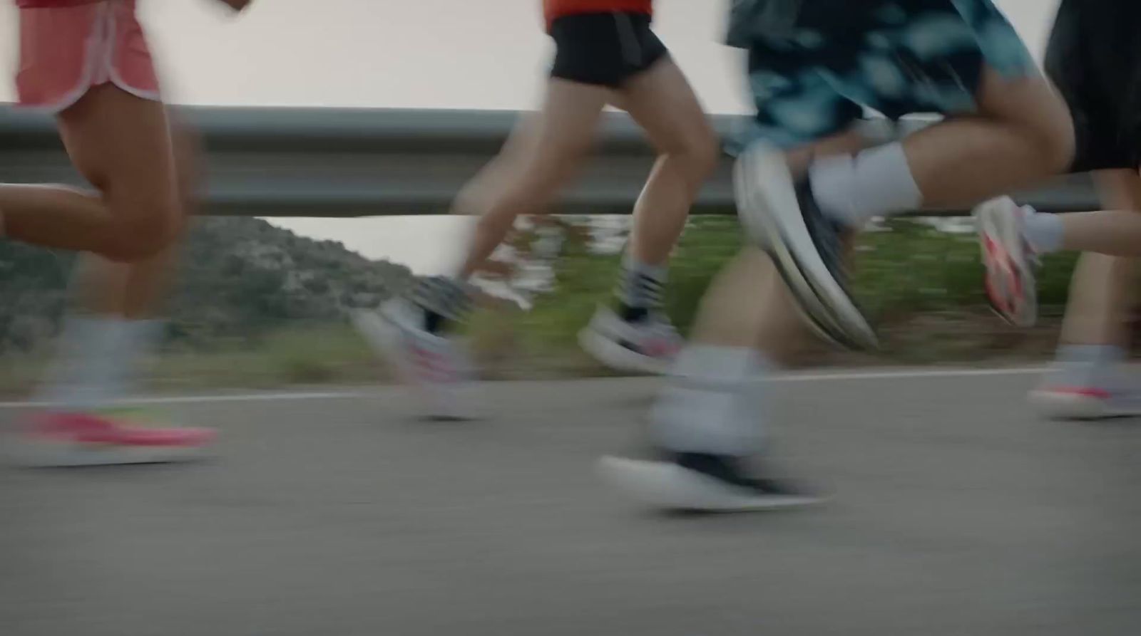 a group of people running down a road