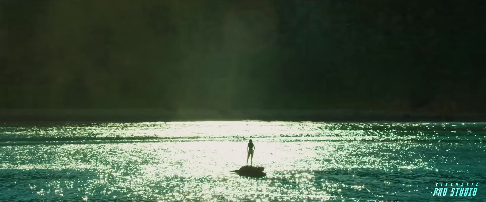 a person standing in the middle of a body of water