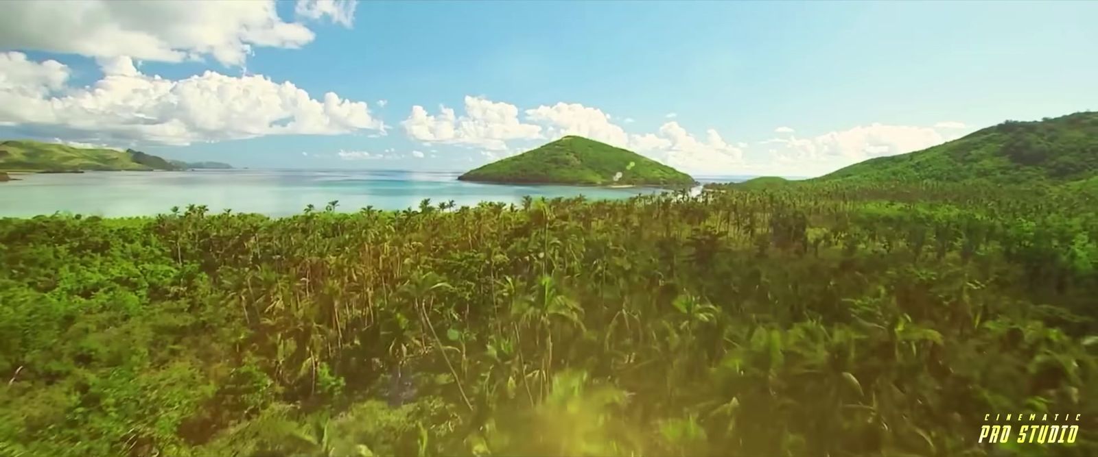 an aerial view of a tropical island in the middle of the ocean