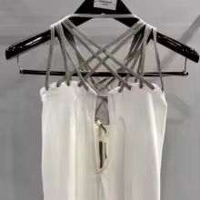 a white dress hanging on a black hanger