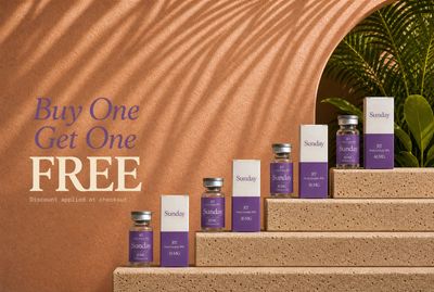 a group of bottles of lavender sitting on top of a set of steps