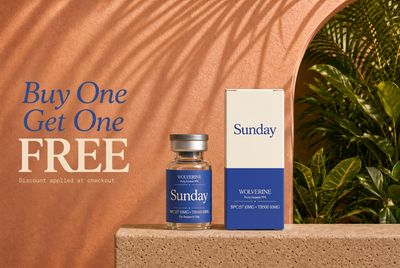 a bottle of sunday next to a box of sunscreen
