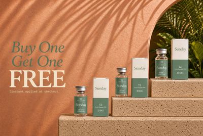 a group of bottles of skin care products sitting on a set of steps
