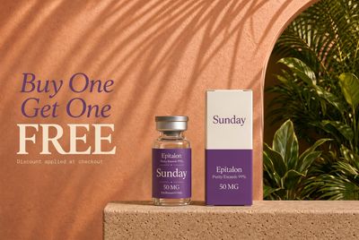 a bottle of sunday sitting on a ledge next to a box of sunday