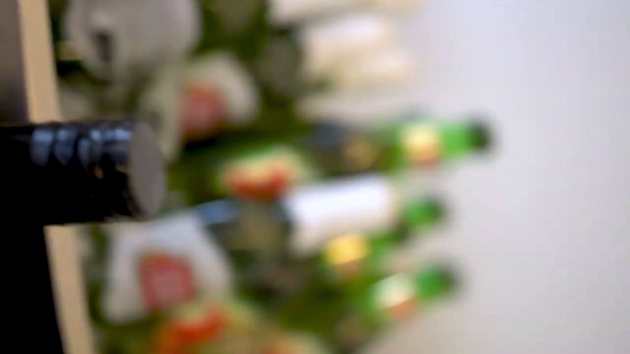 a close up of a wine bottle in a wine rack