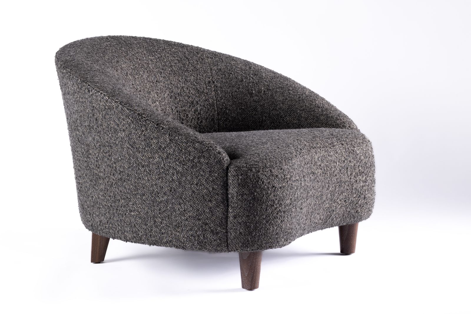 a gray chair with wooden legs and a white background