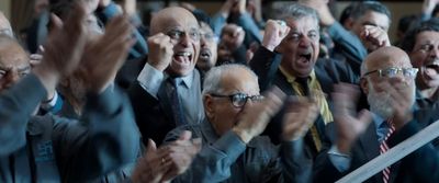 a group of people with their hands in the air