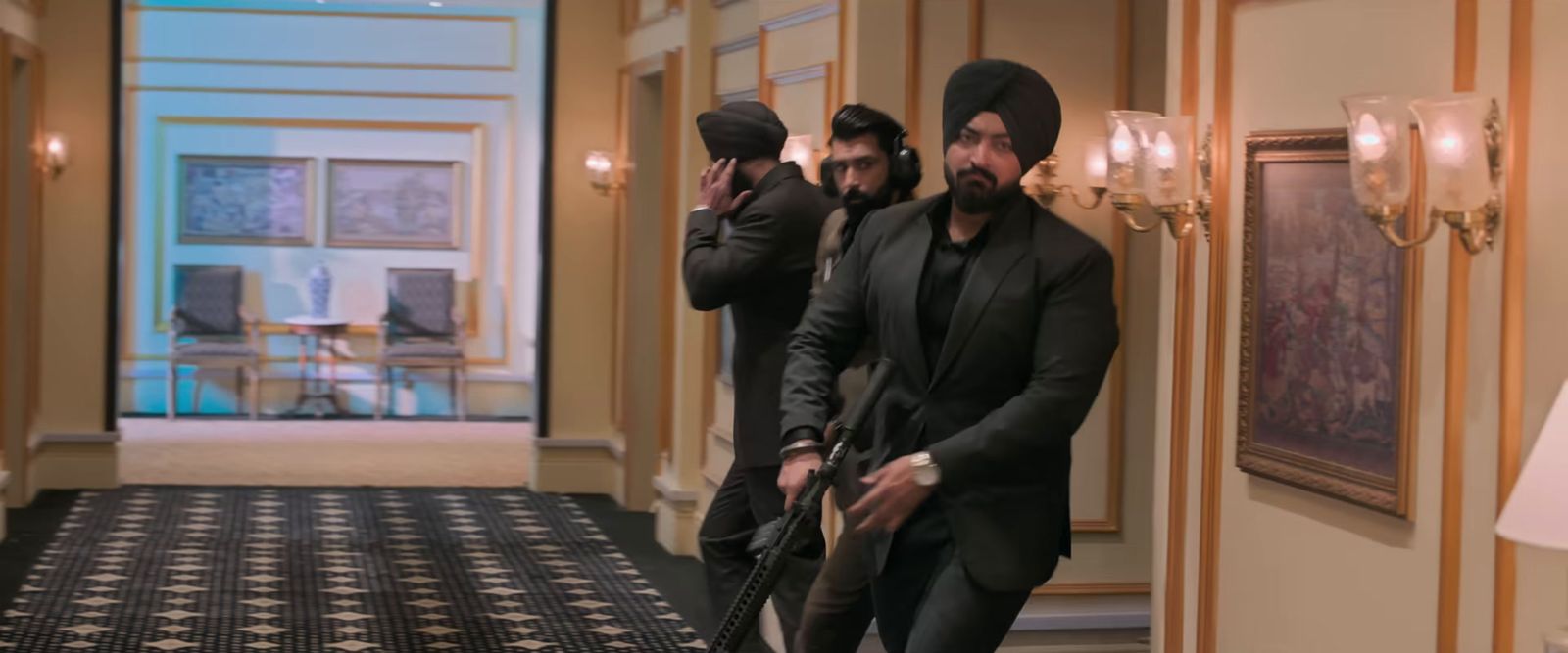 a group of men standing in a hallway