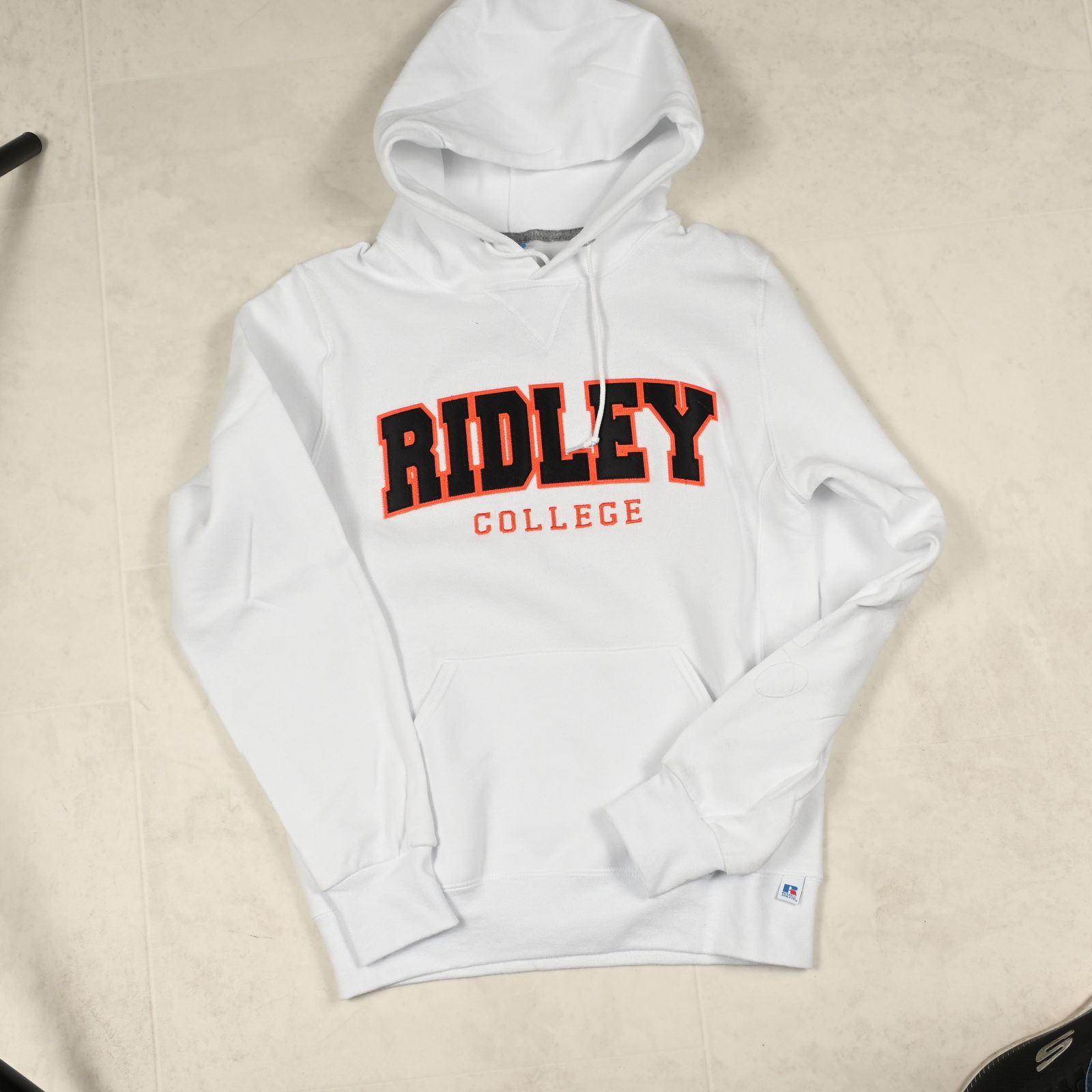 a white hoodie with ridley college on it