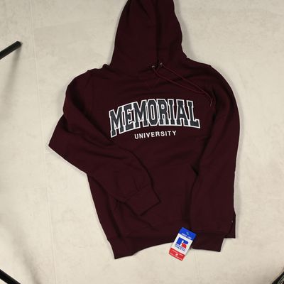 a maroon sweatshirt with the words memorial on it