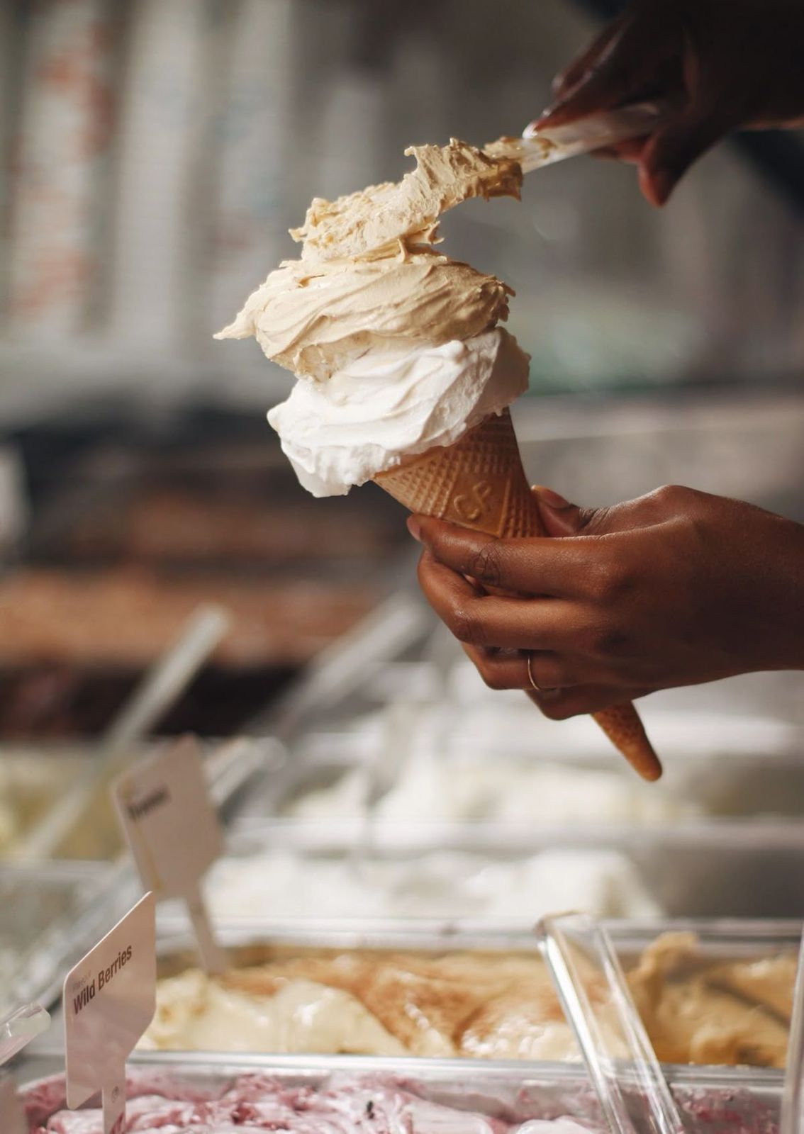 a person is eating an ice cream cone